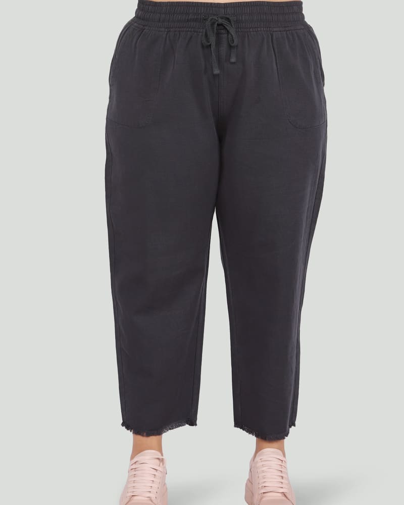Front of a model wearing a size 0X Lauren Tencel Frayed Hem Jogger in Charcoal Wash by DEX PLUS. | dia_product_style_image_id:268425